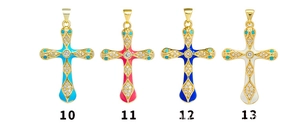 Detail of colorful cross pendants with gold plating and cubic zirconia for jewelry making