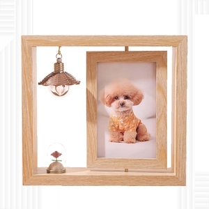 Minimalist 6-inch double-sided rotating wooden photo frame with a mini glass plant display