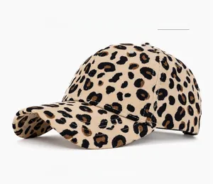 Detailed view of the six-panel structure and large leopard print on the light khaki corduroy cap