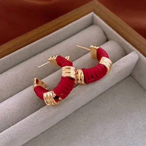 Vintage C-shape hoop earrings with faux leather red thread wrap and gold finish