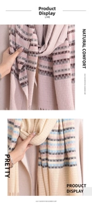 Detail of lilac plaid imitation cashmere scarf showing soft fringe and fine woven texture