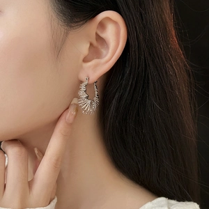 Silver hollow textured hoop earrings with a layered minimalist geometric design for women