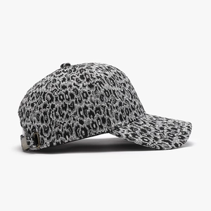 Classic baseball cap featuring a black and white leopard pattern and metal buckle
