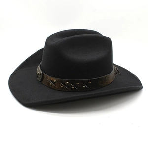 Detail of black western cowboy hat featuring a leather strap with studs and vintage buckle