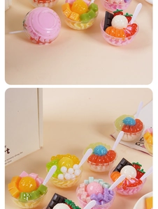 Detailed close-up of miniature dessert bowl models with realistic ice cream and fruit toppings