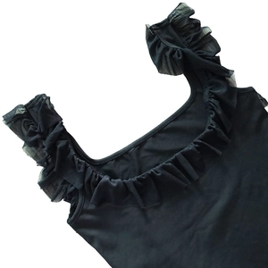 Close-up of black square neck dress with mesh ruffle details and elegant shoulder straps