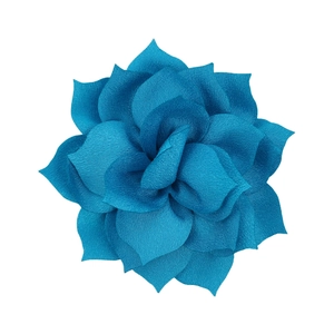 Macro detail of a multilayered teal fabric lotus flower accessory for DIY headbands