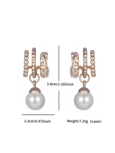 Detailed view of copper pearl earrings with dimensions 2.8cm by 1.2cm on white background