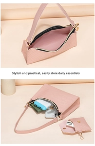 Pink embossed underarm bag interior and mini pouch showing daily storage capacity