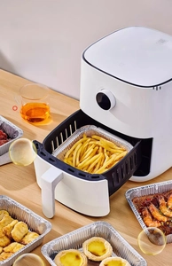 Thickened food-grade aluminum foil pans for air fryer showing crispy fries and snacks