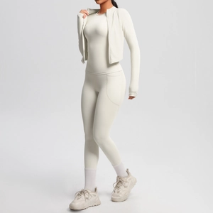 Detail view of cream white yoga set fabric and high-waist fitness leggings seam