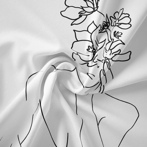 Macro detail of minimalist line art printing on premium white soft textile fabric