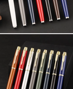 Macro detail of multi-color metallic business rollerball pens with arrow clip design