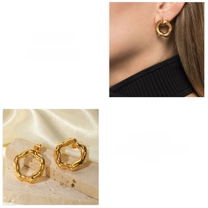 Detailed macro view showing the organic lava texture and 18K gold plating of these earrings