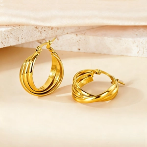 Detail of 18K gold-plated 316L stainless steel triple layer twisted hoop earrings