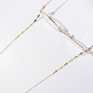Gold-plated cross eyeglass chain for women featuring delicate metal link design