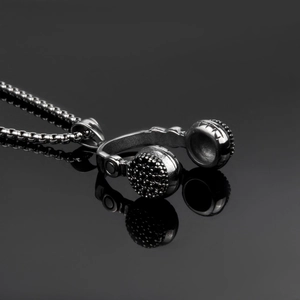 Punk silver headphone pendant necklace with box chain on dark reflective background