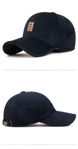 Close-up of navy sports cap with leather patch detail and vintage metal side buckle