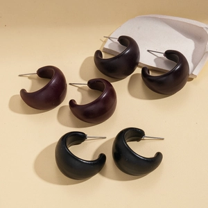 Three pairs of dark acrylic geometric C-shape earrings with a matte vintage finish