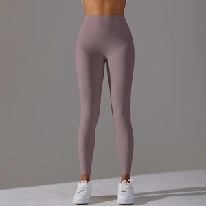 Detailed view of high waist seam and elastic fabric on mauve yoga leggings