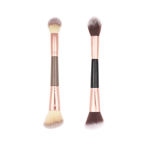 Double-ended makeup brush with soft bristles and rose gold ferrule for blush and contour