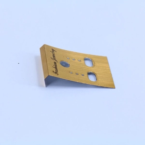 Detail of gold brushed plastic jewelry display card with Fashion Jewelry text