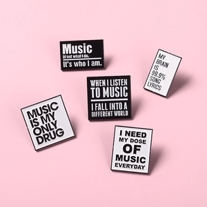 Minimalist black and white enamel pins with inspirational quotes for clothing accessories