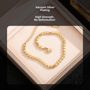 Detail of vacuum-plated gold bracelet with cubic zirconia and lobster clasp closure