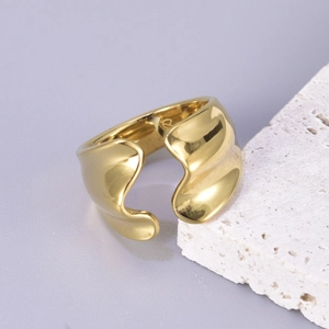 Minimalist irregular fluid gold ring with adjustable open design on white stone base