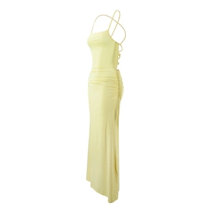 Side view of sexy backless maxi dress with cross strap detail and ruched low waist