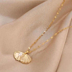 Elegant gold titanium necklace featuring a shell pendant with pearl and zircon accents