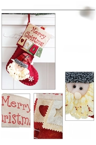 Close-up of Santa Claus 3D embroidery and linen texture on a large Christmas stocking