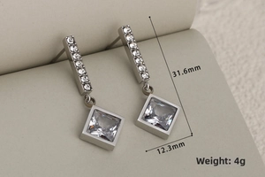 Detailed view of silver square rhinestone earrings with dimensions 31.6mm by 12.3mm