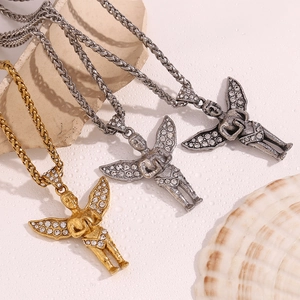 Detailed view of angel wing pendants in gold and silver with sparkling rhinestones
