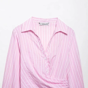 Pink and white striped V-neck long sleeve wrap dress with a cinched waist design