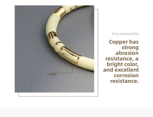 Detailed macro view of cream enamel segments and polished gold copper bangle