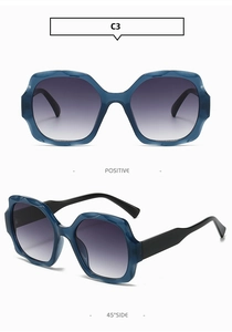 Detail showing wavy frame design and gradient lenses of blue square sunglasses