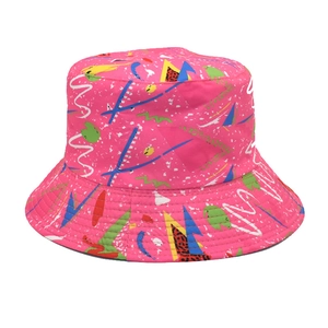 Detail of fuchsia bucket hat featuring vibrant 90s retro geometric graffiti print patterns