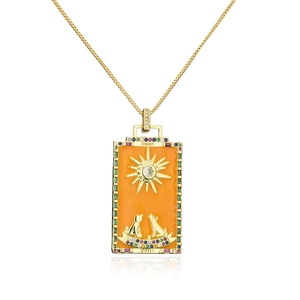 Detailed close-up of 18K gold tarot card pendant with orange enamel and colorful zircons
