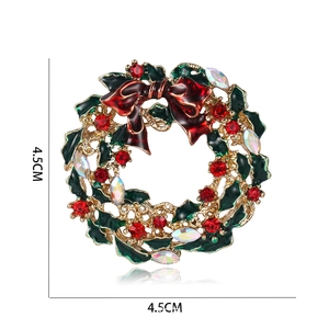 Detailed view of a Christmas wreath brooch with red bow and rhinestones, sized 4.5CM