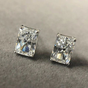 Macro shot of rectangular cut cubic zirconia stud earrings in four-prong silver setting