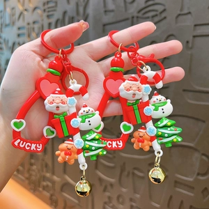 Cute Christmas keychains set featuring Santa Claus snowman and tree charms on red rings