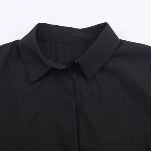 Classic black poplin shirt featuring a structured lapel collar and button-down detail