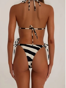 Detail of back view showing the black and white striped bikini top with tie-up straps