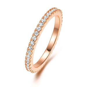 Detail of rose gold eternity ring featuring a single row of sparkling zircon stones