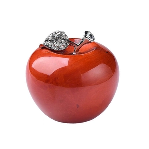 Polished red crystal apple ornament with a sparkling rhinestone-encrusted silver leaf