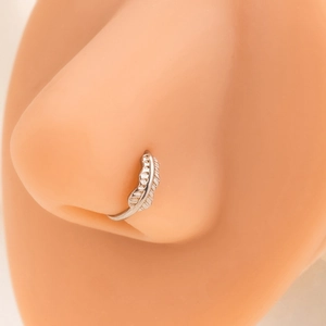 Detailed view of a silver leaf-shaped non-piercing nose ring on a silicone model