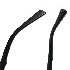 Close-up of sleek black double bridge sunglasses temples with high-gloss polished finish