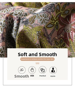 Macro detail of vintage floral paisley print scarf with soft satin texture and twill weave