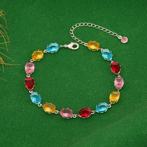 Detail view of multicolored zircon crystals on a silver chain with adjustable lobster clasp